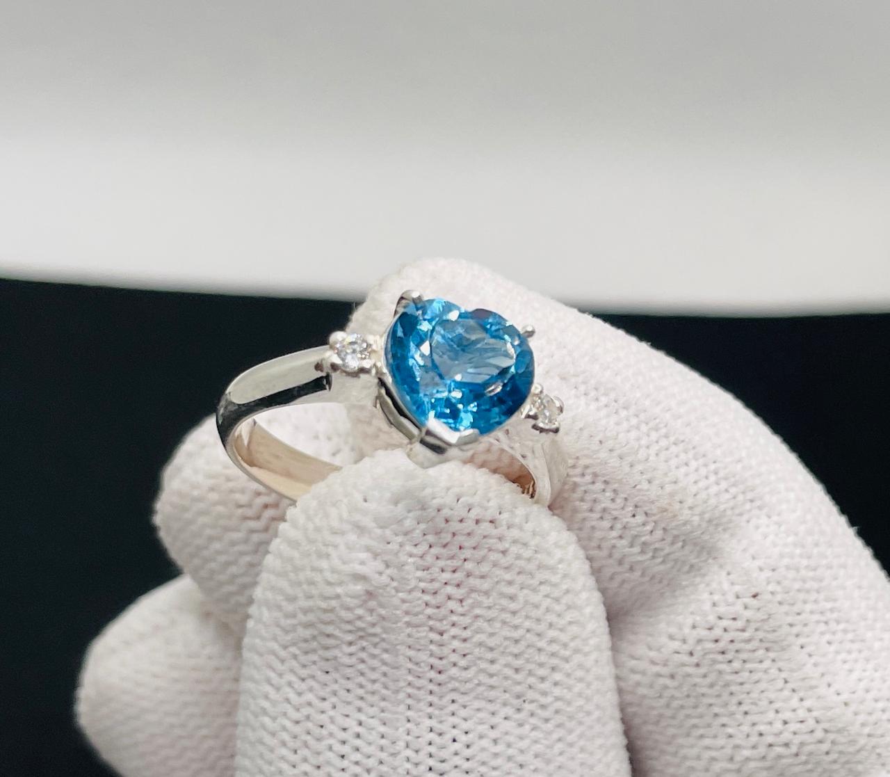 silver ring with natural blue topaz stone